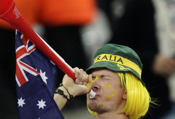 Aussie fan takes a swig from flask.